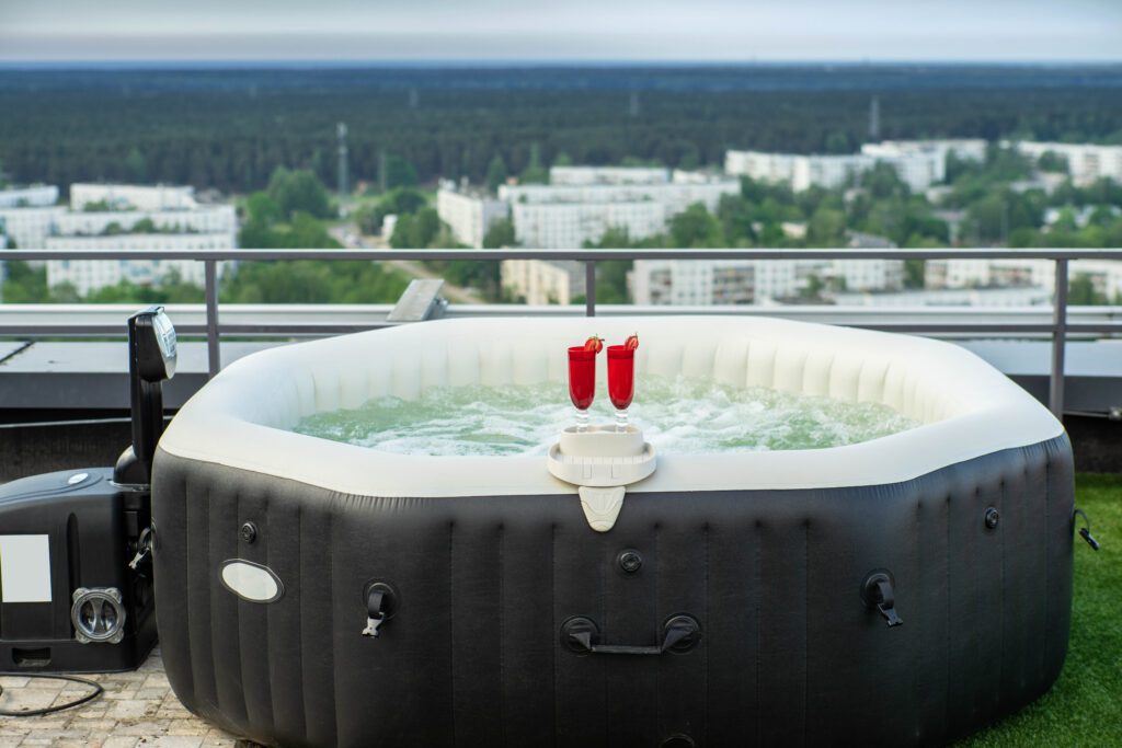 rooftop terrace outdoor jacuzzi with wine glasses.