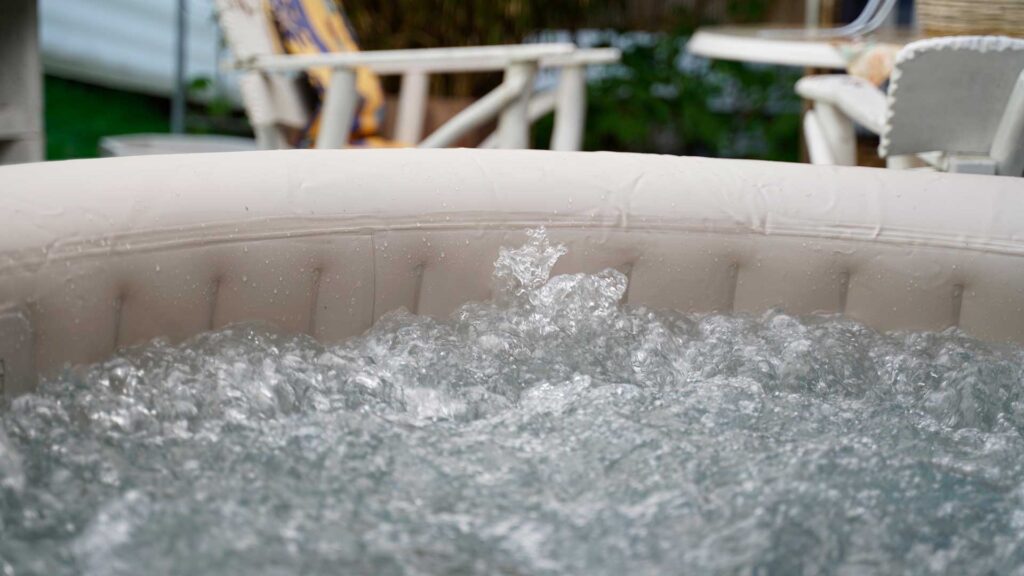 hot tub full with water in garden.