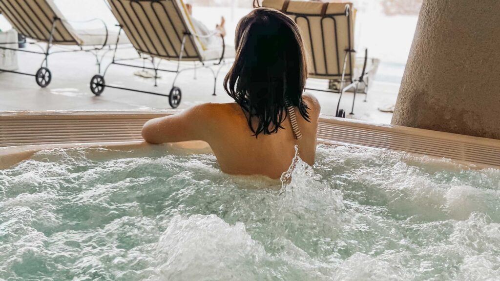 woman relaxing in hot tub.