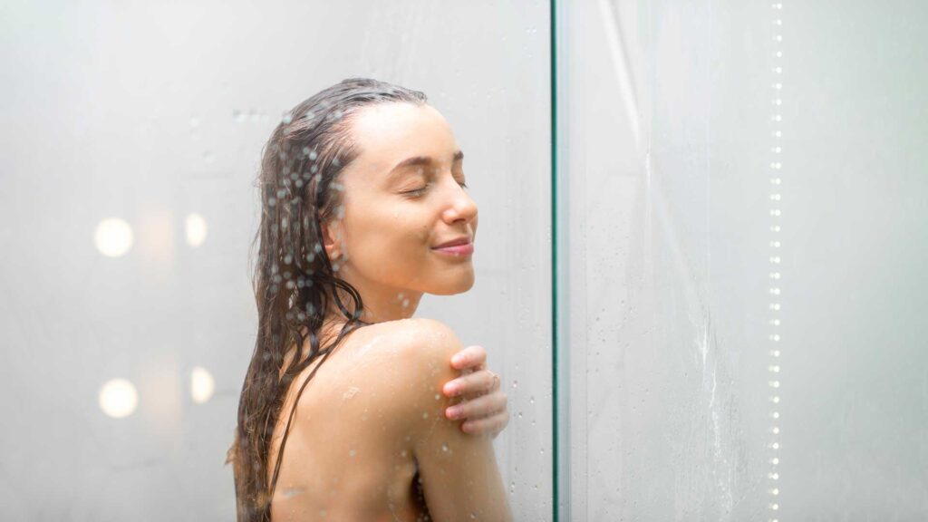 young woman taking shower body skin hygiene.