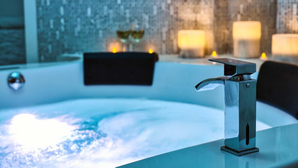 Blue bubbling Water in Spa Jacuzzi.