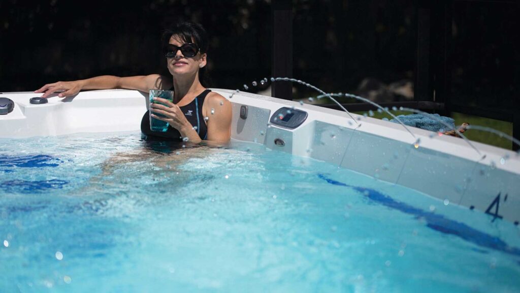 woman drink water in hot tub.