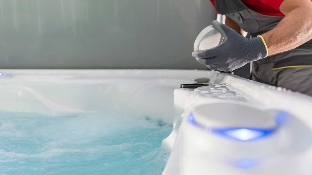 technician fiting filter in jacuzzi tub.