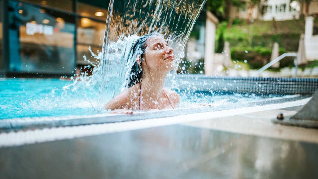 young girl relaxing swimming pool spas.