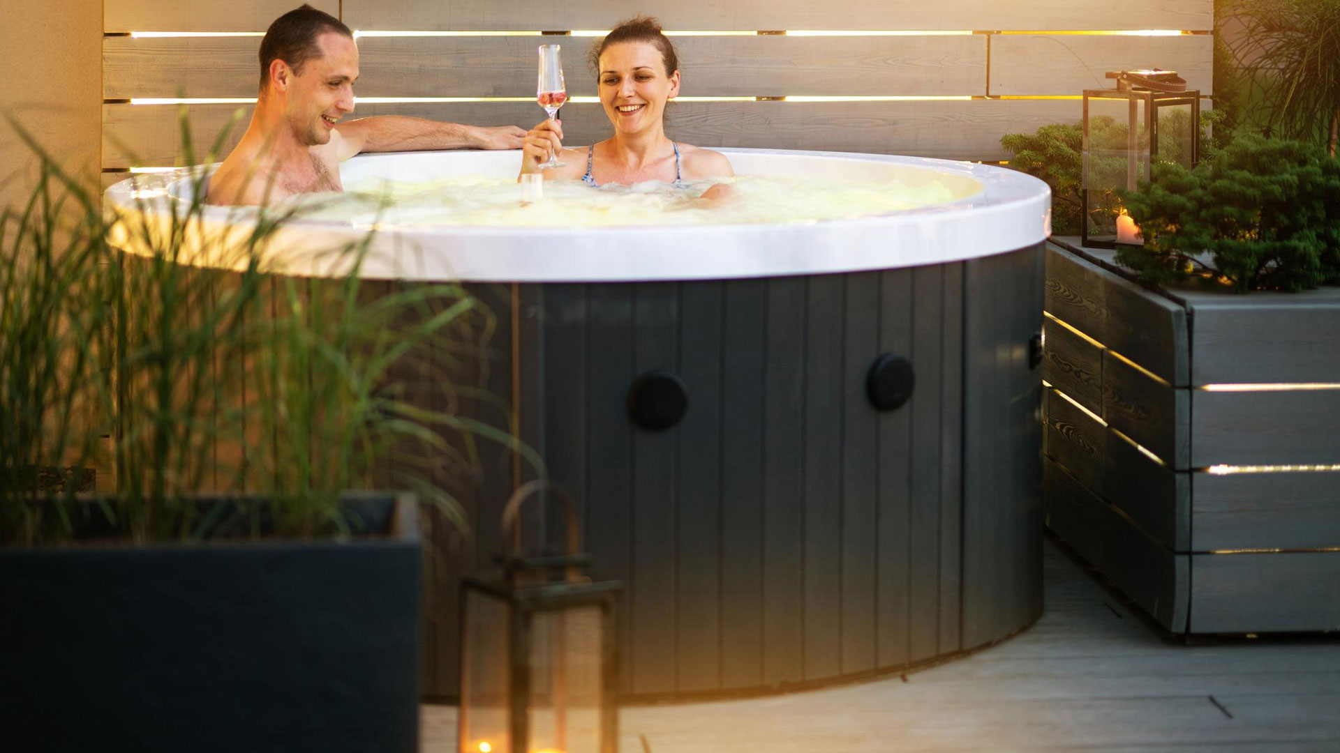 couple taking bath in basement hot tub