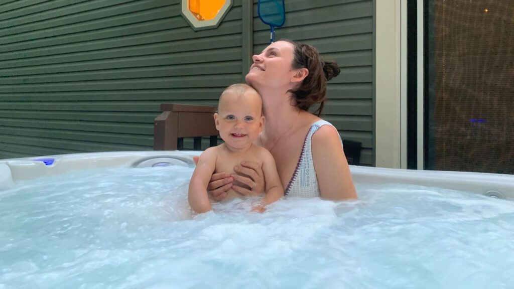 mother with her kid in hot tub